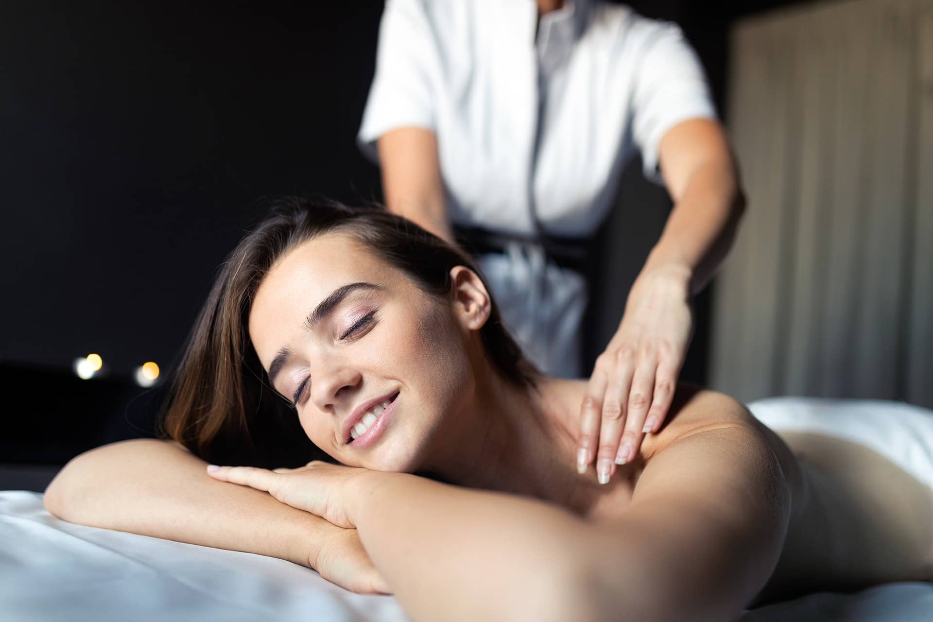 Massage, health, beauty and relaxation concept. Beautiful woman in spa salon